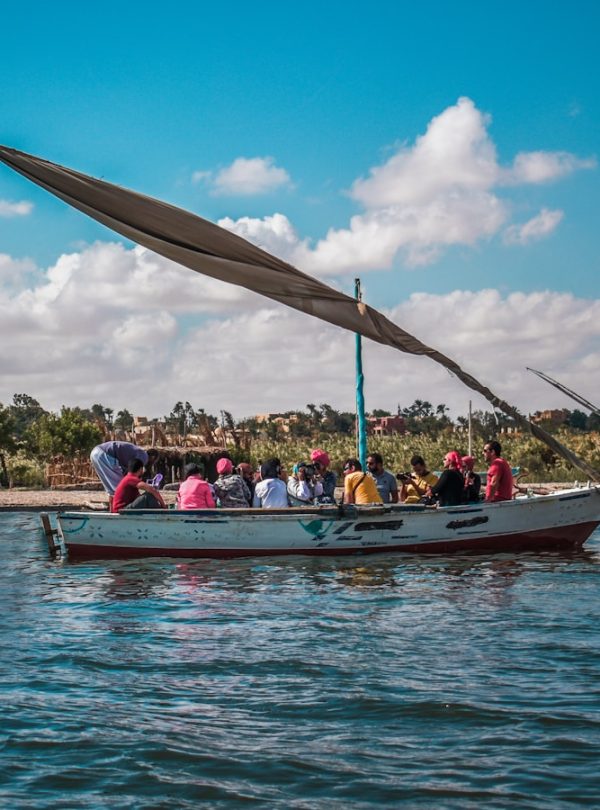 a group of people riding on the back of a boat